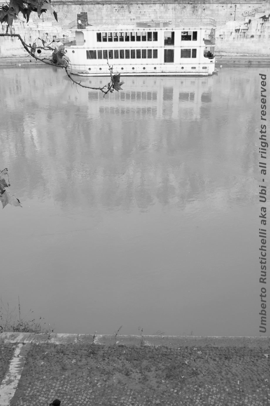 a black and white shot of the Tiber in Rome