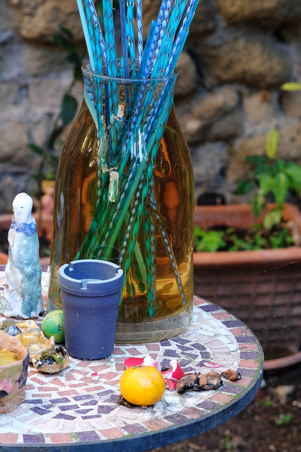 brown bottle with glass crafts, photo taken with the Zeiss Sonnar 85mm f/2.8
